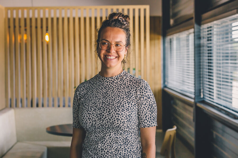 Young employee smiling in office